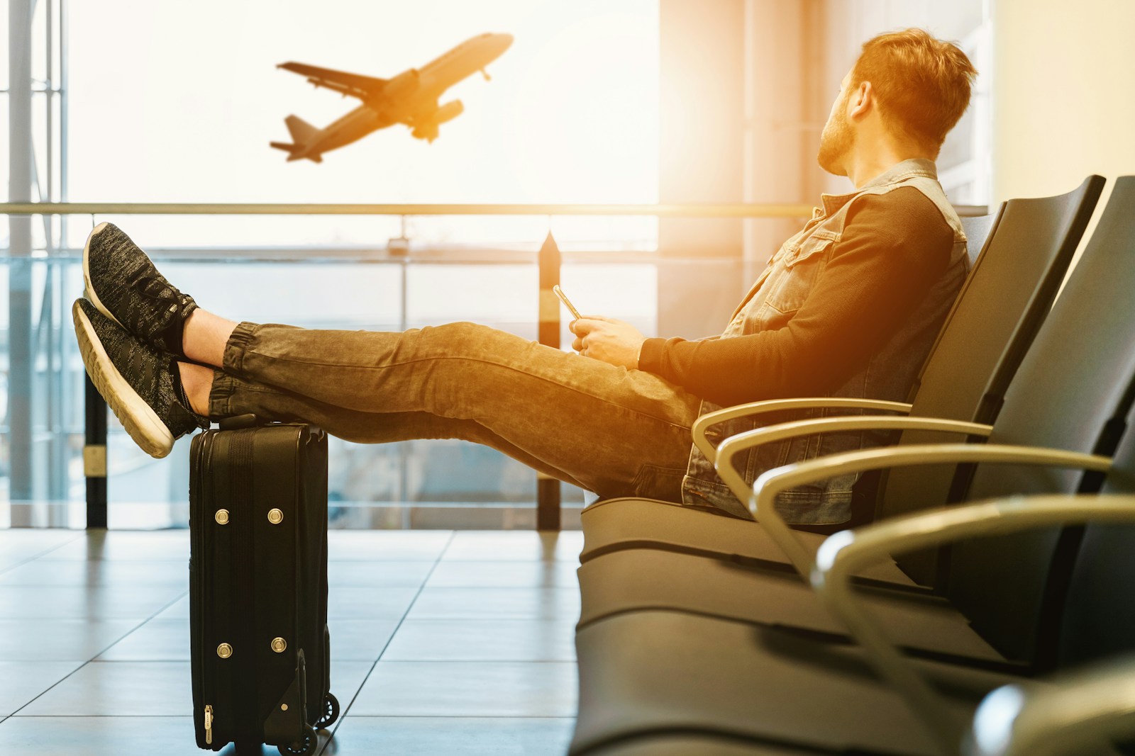 a relaxed passenger who has travel insurance